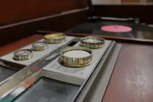 Interior view of an open Zenith console featuring an upgraded Audio Technica turntable and integrated high-res streaming components.
