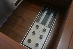 Close-up of original polished RCA Victor control knobs and faceplate on the "Cassidy" modernized console.