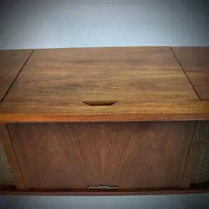 Wooden record player with 'Lectrahome' logo.
