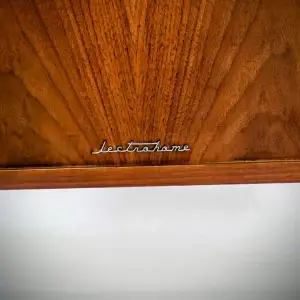 "lectrohome" logo on a wooden surface.