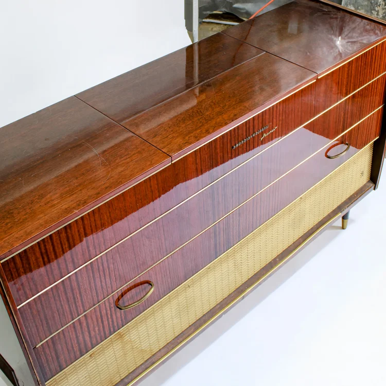 Mid-century modern cabinet with rosewood and brass details.