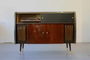 Vintage wooden cabinet with record player.