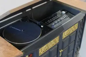 Top-down view of the interior of a GE Multiplex "Angus" console featuring internal LED lighting and an Audio-Technica turntable.