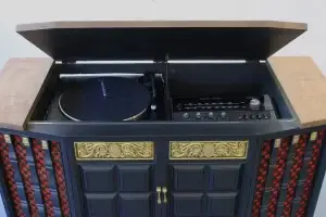 Top-down straight-on view of the restored interior audio deck of a GE Multiplex including turntable and controls. cabinet.