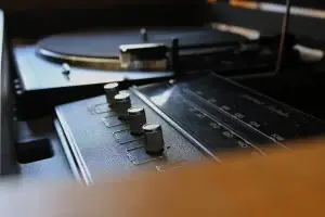 Close-up of restored General Electric controls with an Audio-Technica turntable in the background on the "Angus" console.