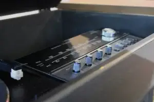 Extreme close-up of restored and polished original General Electric Multiplex control knobs and faceplate.