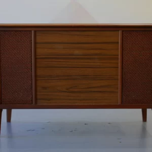 Mid-century modern wooden cabinet with woven panels on the sides.