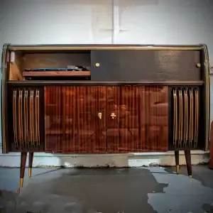 Wooden cabinet with record player inside.
