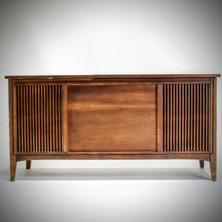 Wooden sideboard with slatted doors and a sliding center panel.
