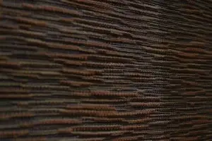 Close-up of brown fabric with horizontal texture.