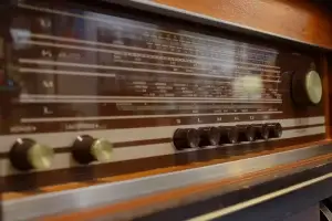 Vintage radio with wooden cabinet and dials.