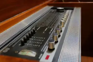 Vintage soundboard with knobs and sliders.