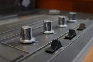 Close-up of the source selector knob on a GE Kubrick console restored with modern streaming and HDMI inputs.