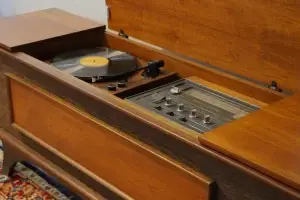 Interior view of a restored GE Kubrick console showing a new Audio-Technica turntable and upgraded controls.
