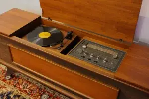 Interior of a restored GE Kubrick console showing a new Audio-Technica turntable and HDMI ARC connectivity.