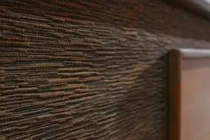 Close-up of the period-correct speaker cloth and architectural wood slats on a restored GE Kubrick.