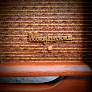 Close-up of the vintage Magnavox gold badge on a restored Steiner Audio Brubeck speaker grille.