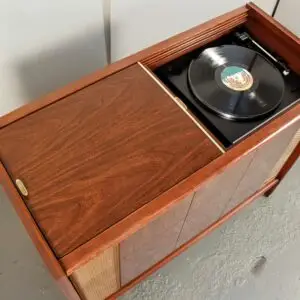 Interior view of a restored Magnavox Brubeck console with original illuminated tuner dial and new turntable.
