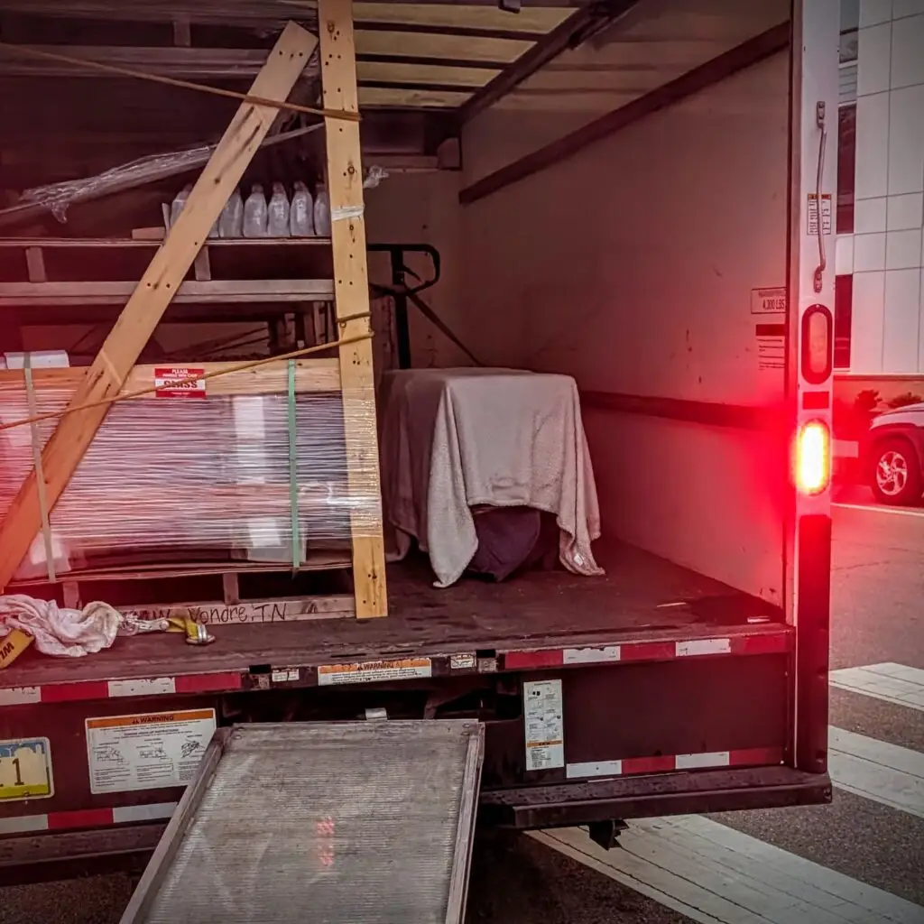 Restored vintage mid-century stereo console being prepared for white-glove shipping in the Steiner Audio Memphis workshop.