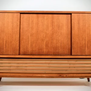Restoring the iconic gold metal speaker lattice on a 1960s Telefunken Hymnus.