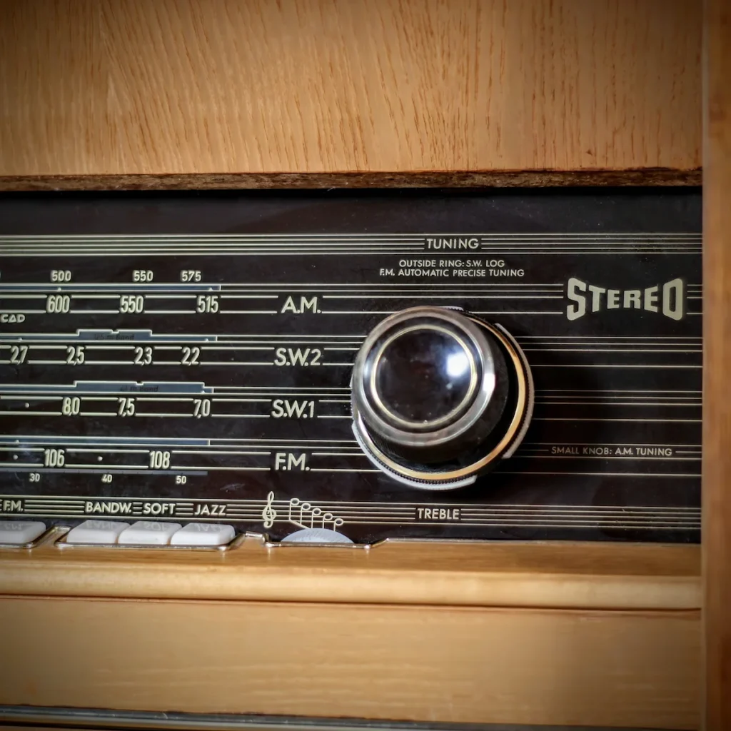 Close-up of the "Stereo" badge and tuning dial on the restored Telefunken console.